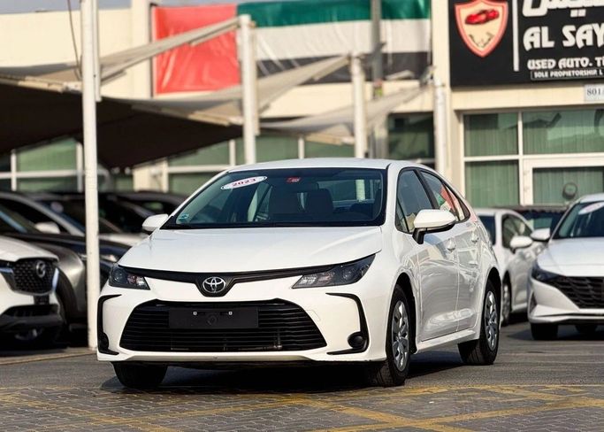 Подержанный Toyota Corolla XII (E210), 1.6 л, 2023 в Шардже от Al Sayed Khamis Used Auto Trading Белый цвет. GCC | AUTO.AE