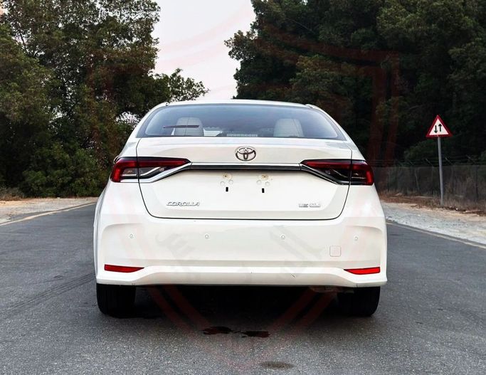 Подержанный Toyota Corolla XII (E210), 1.6 л, 2022 в Шардже от Al Sayed Khamis Used Auto Trading Белый цвет. GCC | AUTO.AE