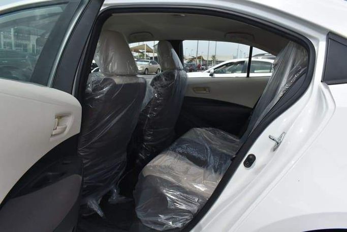 Подержанный Toyota Corolla XII (E210), 1.6 л, 2021 в Шардже от OMC Used Cars Белый цвет. GCC | AUTO.AE