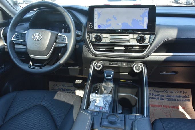 Подержанный Toyota Grand Highlander, 2.4 л, 2024 в Шардже от Alfaris Used Cars Синий цвет.  | AUTO.AE