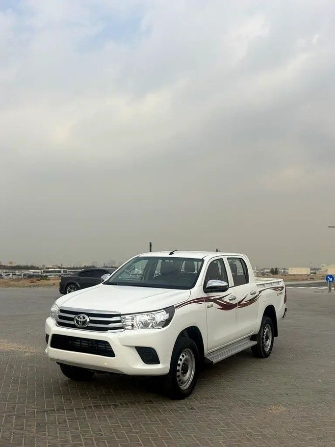 Used Toyota Hilux VIII, 2.7 l, 2022 in Sharjah by Al Jawareh Used Cars, White color. GCC Specs | AUTO.AE
