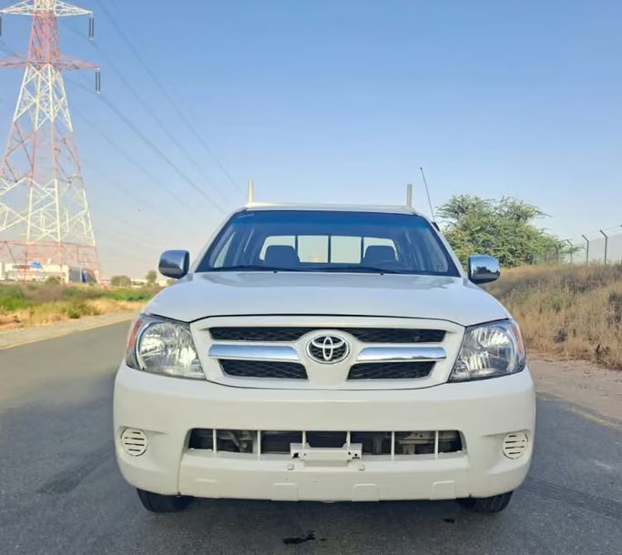 Used ⁦Toyota Hilux VII, 2.7 l, 2007⁩ in UAE, Sharjah by Wahat Al Umra Used Cars, White color. GCC Specs | AUTO.AE | Listing #289555