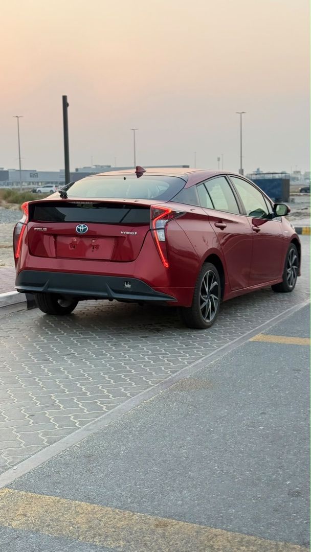 Used ⁦Toyota Prius IV (XW50), 1.8 l, 2016⁩ in UAE, Sharjah by IQRA USED CARS TARDING EXHB LLC, Red color. American Specs | AUTO.AE | Listing #289847