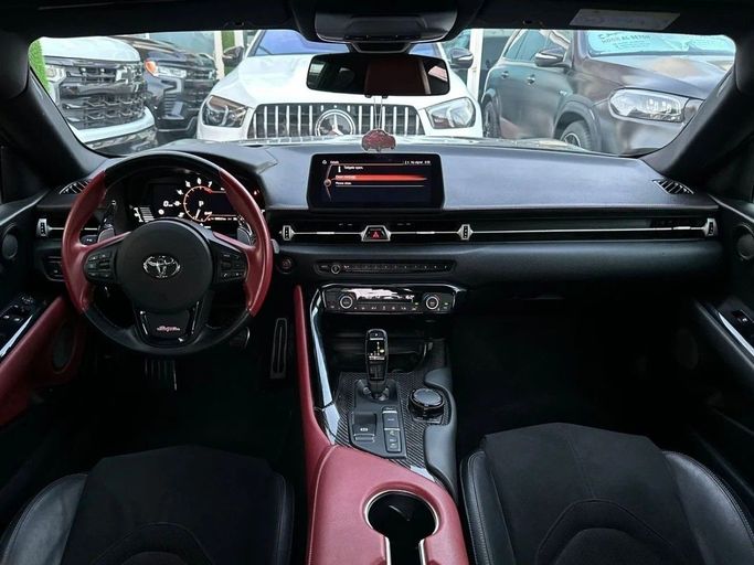 Подержанный Toyota Supra V (A90), 3.0 л, 2023 в Шардже от Noor Al Seyoh Used Cars Красный цвет. GCC | AUTO.AE