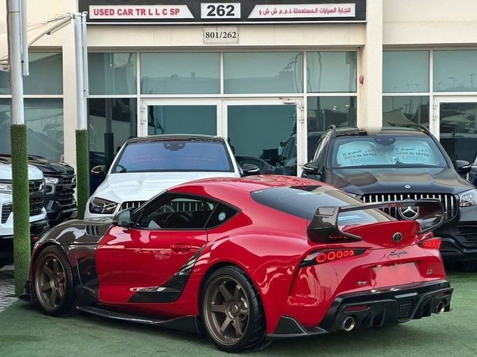 Подержанный Toyota Supra V (A90), 3.0 л, 2023 в Шардже от Noor Al Seyoh Used Cars Красный цвет. GCC | AUTO.AE