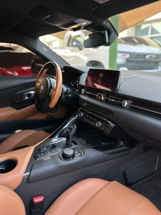 Подержанный Toyota Supra V (A90), 3.0 л, 2023 в Шардже от Noor Al Seyoh Used Cars Красный цвет. GCC | AUTO.AE