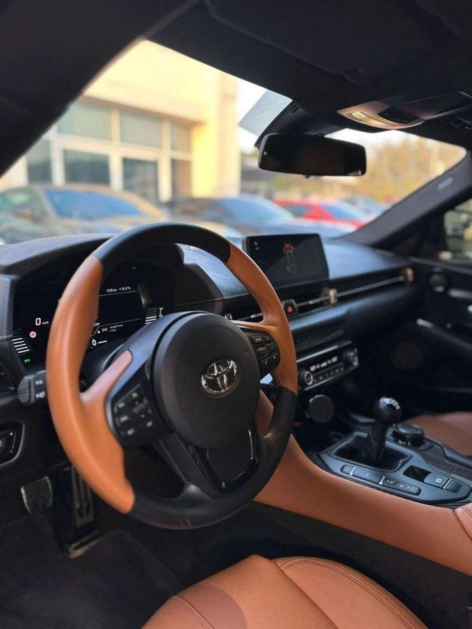 Подержанный Toyota Supra V (A90), 3.0 л, 2024 в Шардже от Noor Al Seyoh Used Cars Серый цвет. GCC | AUTO.AE