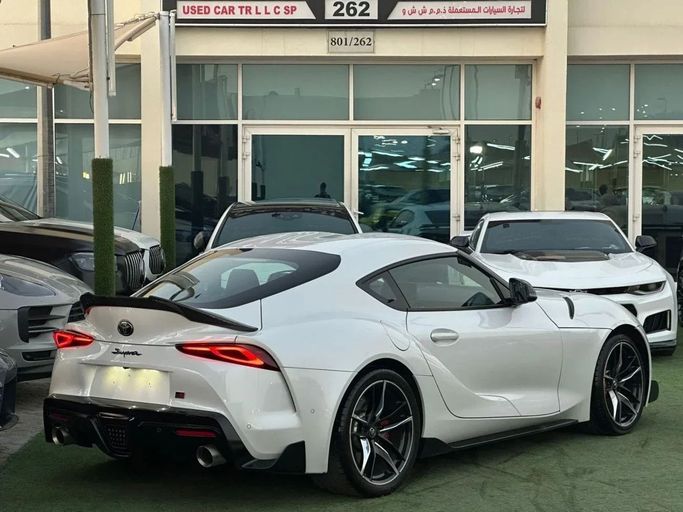 Used Toyota Supra V (A90), 3.0 l, 2022 in Sharjah by Noor Al Seyoh Used Cars, White color. GCC Specs | AUTO.AE