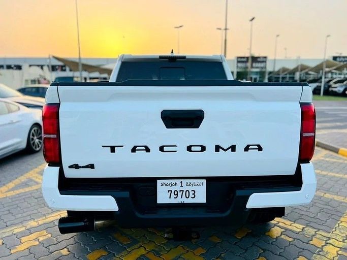 Used Toyota Tacoma IV, 2.4 l, 2024 in Sharjah by Karkuk Used Cars, White color. American Specs | AUTO.AE