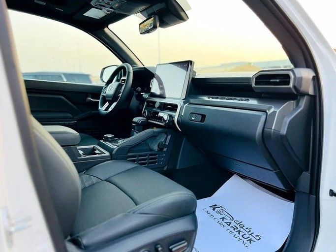 Used Toyota Tacoma IV, 2.4 l, 2024 in Sharjah by Karkuk Used Cars, White color. American Specs | AUTO.AE