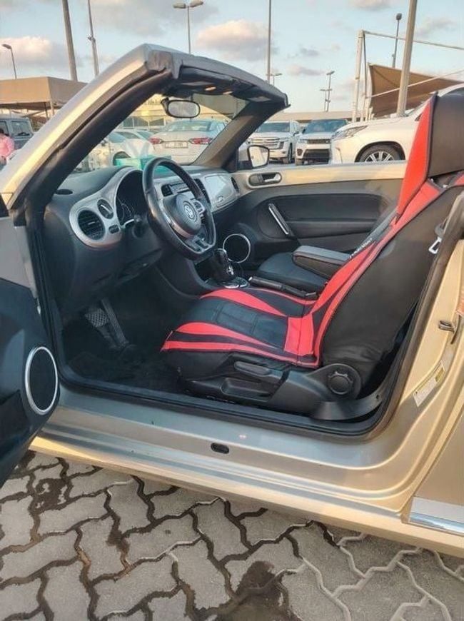 Used Volkswagen Beetle II (A5), 1.8 l, 2014 in Sharjah by Alnujoom Al Malakiah Used Cars, Golden color. American Specs | AUTO.AE