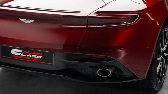 Used Aston Martin DB11 I, 5.2 l, 2018 in Dubai by Al Ain Class Motors, Red color. GCC Specs | AUTO.AE