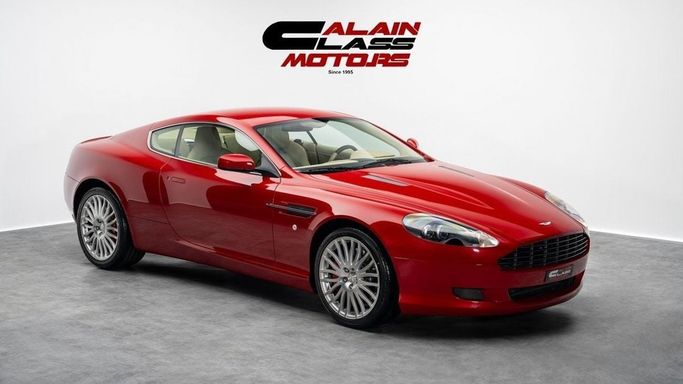 Подержанный Aston Martin DB9 I Рестайлинг, 5.9 л, 2009 в Дубае от Al Ain Class Motors Красный цвет. GCC | AUTO.AE