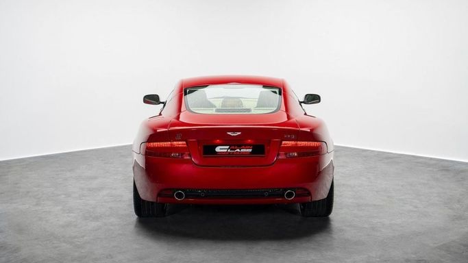 Подержанный Aston Martin DB9 I Рестайлинг, 5.9 л, 2009 в Дубае от Al Ain Class Motors Красный цвет. GCC | AUTO.AE