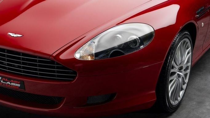 Подержанный Aston Martin DB9 I Рестайлинг, 5.9 л, 2009 в Дубае от Al Ain Class Motors Красный цвет. GCC | AUTO.AE