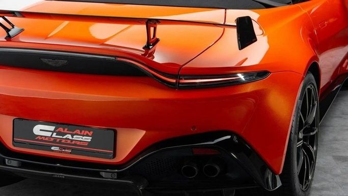 Used Aston Martin V8 Vantage IV, 4.0 l, 2022 in Dubai by Al Ain Class Motors, Orange color. European Specs | AUTO.AE