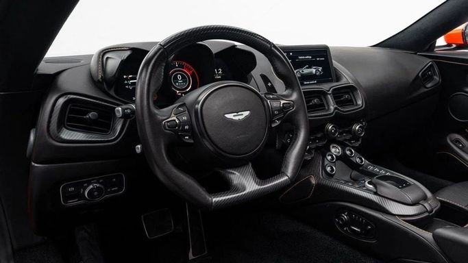 Used Aston Martin V8 Vantage IV, 4.0 l, 2022 in Dubai by Al Ain Class Motors, Orange color. European Specs | AUTO.AE