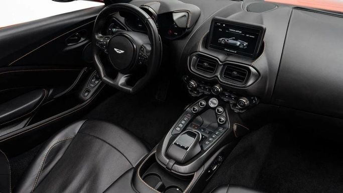 Used Aston Martin V8 Vantage IV, 4.0 l, 2022 in Dubai by Al Ain Class Motors, Orange color. European Specs | AUTO.AE