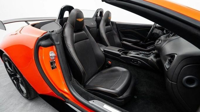 Used Aston Martin V8 Vantage IV, 4.0 l, 2022 in Dubai by Al Ain Class Motors, Orange color. European Specs | AUTO.AE