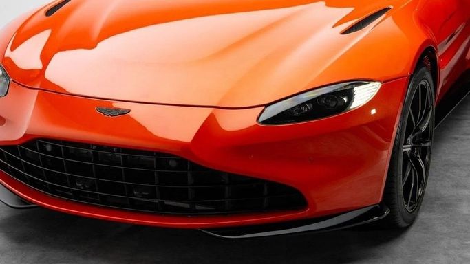 Used Aston Martin V8 Vantage IV, 4.0 l, 2022 in Dubai by Al Ain Class Motors, Orange color. European Specs | AUTO.AE