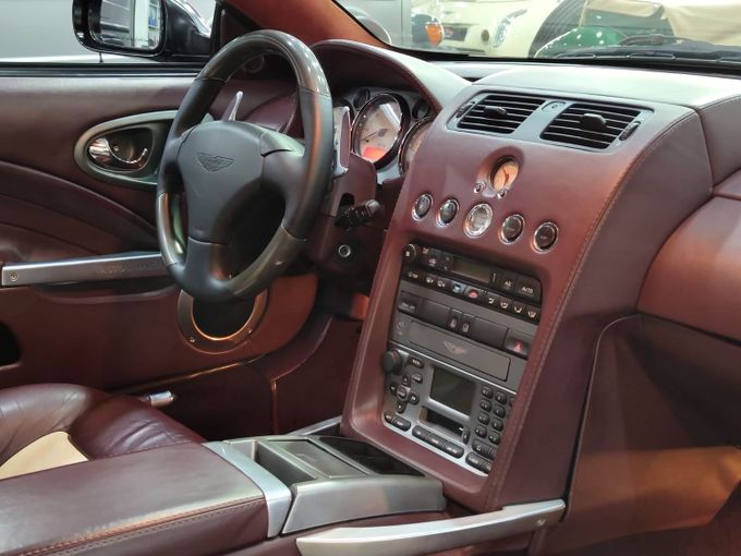 Подержанный Aston Martin Vanquish S I, 5.9 л, 2005 в Дубае от STAR COLLECTION LLC Коричневый цвет. GCC | AUTO.AE