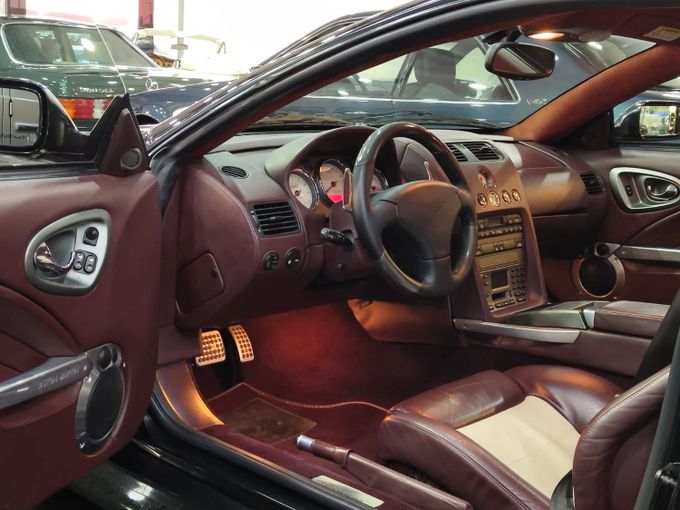 Подержанный Aston Martin Vanquish S I, 5.9 л, 2005 в Дубае от STAR COLLECTION LLC Коричневый цвет. GCC | AUTO.AE