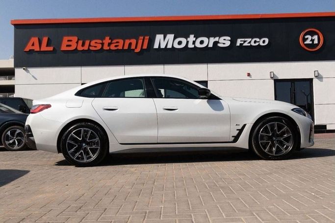 New BMW i4 eDrive35 G26 Facelift, 2024 in Dubai by Albustanji Motors FZCO, White color.  | AUTO.AE