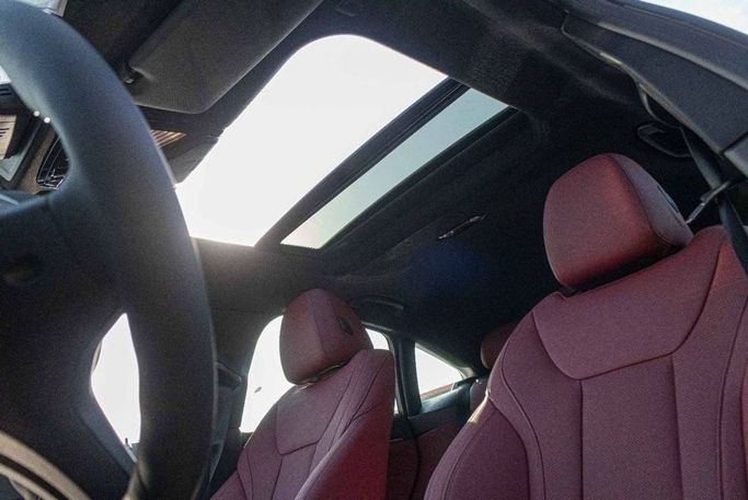 New BMW i4 eDrive40 G26 Facelift, 2025 in Dubai by Albustanji Motors FZCO, Grey color.  | AUTO.AE