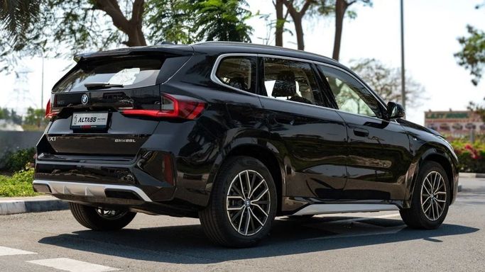 New BMW iX1 eDrive, 2022 in Dubai by Altass Motors, Black color.  | AUTO.AE