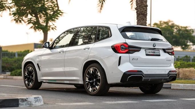 New BMW iX3 I (G08) Facelift, 2025 in Dubai by Altass Motors, White color.  | AUTO.AE