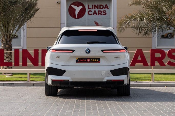 Used BMW iX xDrive50 I (I20), 2023 in Dubai by Linda Cars, White color. GCC Specs | AUTO.AE