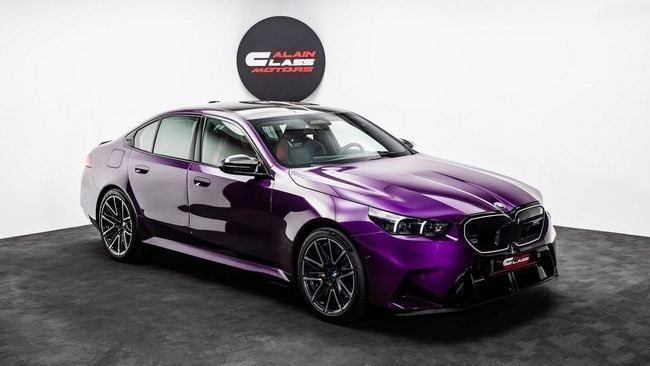New BMW M5 VII (G90), 4.4 l, 2025 in Dubai by Al Ain Class Motors, Purple color. GCC Specs | AUTO.AE