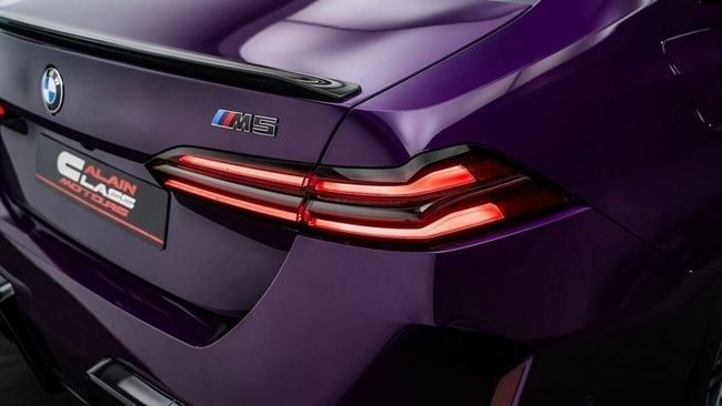 New BMW M5 VII (G90), 4.4 l, 2025 in Dubai by Al Ain Class Motors, Purple color. GCC Specs | AUTO.AE
