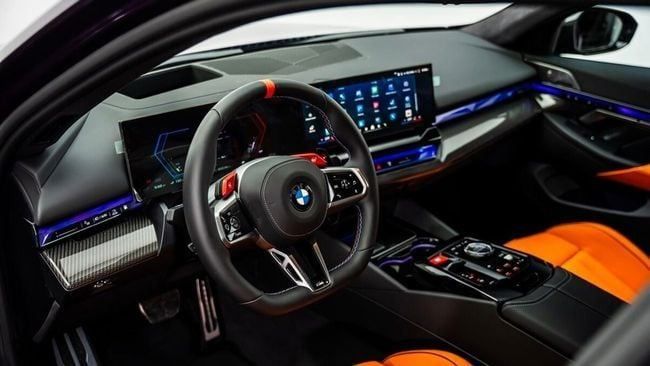 New BMW M5 VII (G90), 4.4 l, 2025 in Dubai by Al Ain Class Motors, Purple color. GCC Specs | AUTO.AE