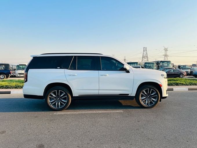 Used Cadillac Escalade V, 6.2 l, 2023 in Dubai by Lakhani Motors, White color. American Specs | AUTO.AE
