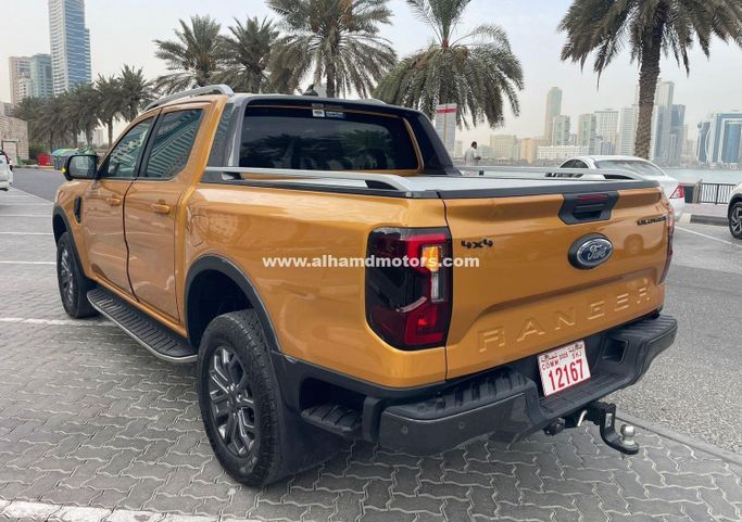 Подержанный Ford Ranger T6.2, 2.0 л, 2024 в Дубае от Alhamd Motors Оранжевый цвет. Other | AUTO.AE