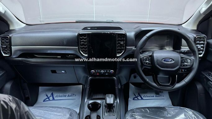 Used Ford Ranger T6.2, 3.0 l, 2023 in Dubai by Alhamd Motors, Orange color. Other | AUTO.AE