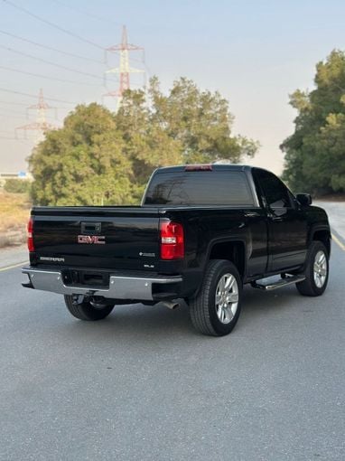 Подержанный GMC Sierra III (K2XX) Рестайлинг, 6.2 л, 2016 в Дубае от Alzahiah Cars Черный цвет. GCC | AUTO.AE