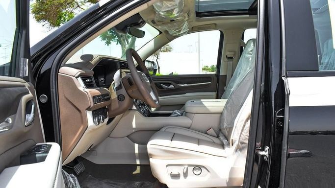 New GMC Yukon V, 6.2 l, 2024 in Dubai by Najem Motors, Black color. GCC Specs | AUTO.AE
