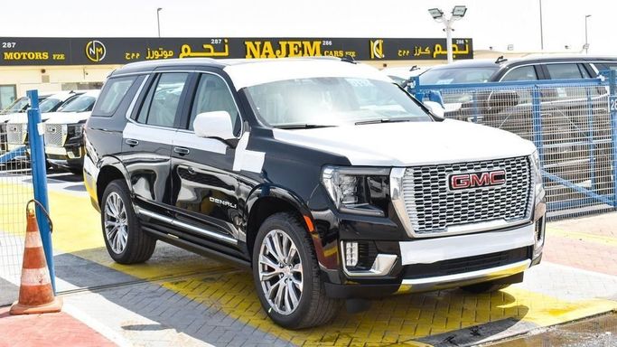 New GMC Yukon V, 6.2 l, 2023 in Dubai by Najem Motors, Black color. GCC Specs | AUTO.AE