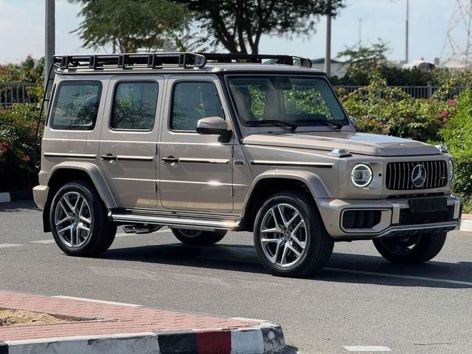 Новый Mercedes-Benz G-Class AMG 63 AMG II (W465) Рестайлинг, 4.0 л, 2025 в Дубае от Royal Motors Золотистый цвет. GCC | AUTO.AE
