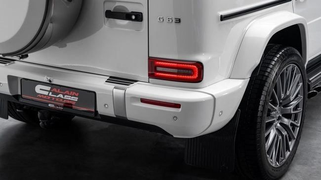 Used Mercedes-Benz G-Class AMG 63 AMG II (W465) Facelift, 4.0 l, 2025 in Dubai by Al Ain Class Motors, White color. GCC Specs | AUTO.AE