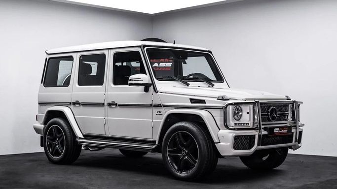 Used Mercedes-Benz G-Class AMG 65 AMG I (W463) Facelift 2, 6.0 l, 2014 in Dubai by Al Ain Class Motors, White color. GCC Specs | AUTO.AE