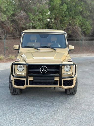 Подержанный Mercedes-Benz G-Class AMG 63 AMG I (W463) Рестайлинг 2, 5.5 л, 2015 в Дубае от Alzahiah Cars Золотистый цвет. GCC | AUTO.AE
