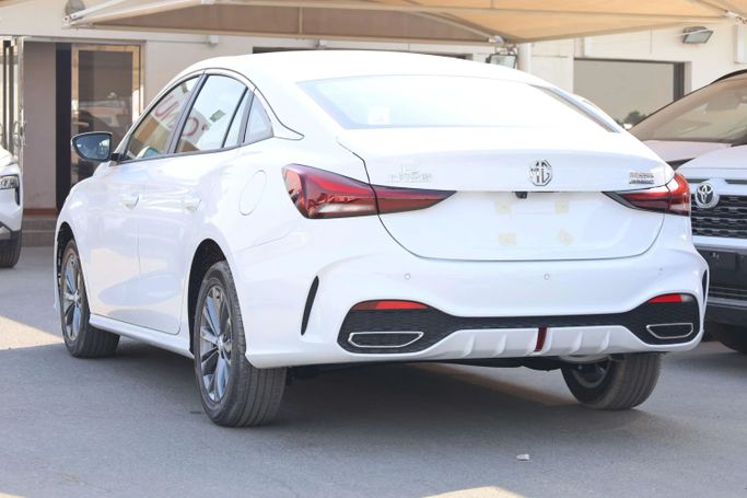 New MG 5 II, 1.5 l, 2025 in Dubai by JES Motors, White color.  | AUTO.AE
