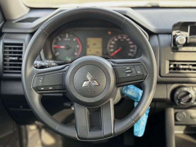 New Mitsubishi L200 VI, 2.4 l, 2025 in Dubai by Mohamed Hakim Motors, White color. GCC Specs | AUTO.AE