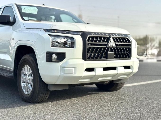 New Mitsubishi L200 VI, 2.4 l, 2025 in Dubai by Mohamed Hakim Motors, White color. GCC Specs | AUTO.AE