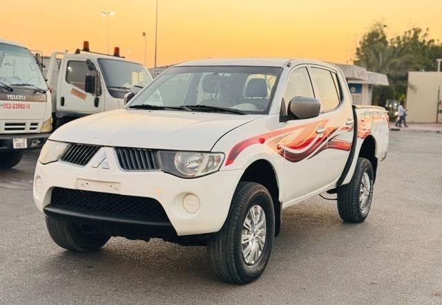 Подержанный Mitsubishi L200 IV, 2.5 л, 2009 в Дубае от Alhamd Motors Белый цвет. GCC | AUTO.AE
