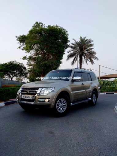 Used Mitsubishi Pajero IV Facelift 2, 3.5 l, 2015 in Dubai by Alhamd Motors, Golden color. GCC Specs | AUTO.AE