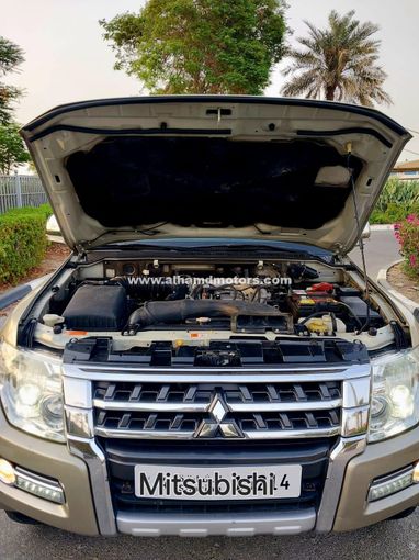 Used Mitsubishi Pajero IV Facelift 2, 3.5 l, 2015 in Dubai by Alhamd Motors, Golden color. GCC Specs | AUTO.AE
